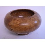 A treen turned bowl, 30.5 cm wide, and a metal sculpture, 29.