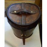 A late 19th/early 20th century leather top hat box, with brass fittings and purple quilted interior,