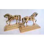 A pair of late 19th century brass doorstops, in the form of horses,
