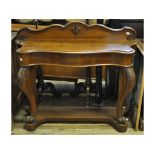 A Victorian oak console or hall table, on carved cabriole legs on knurl feet joined by an undertier,