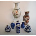 A Chinese porcelain vase, decorated birds amongst flowers and foliage, drilled, 21 cm high,