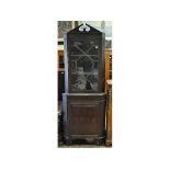 A floor standing mahogany corner cupboard,