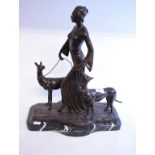 An Art Deco style bronze group, in the form of a lady with two dogs, on a marble base,