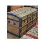 A dome top trunk, a low stool,