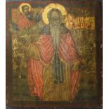 A painted wood icon, 44 x 34 cm, two others similar, 27.