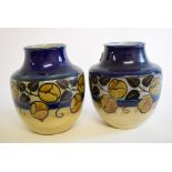 A pair of Royal Doulton stoneware vases, decorated flowers and foliage, 8001,
