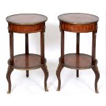 A pair of Louis XVI style inlaid mahogany two tier occasional tables, on cabriole legs,