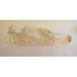 A blanc de chine figure, of a recumbent Buddha,