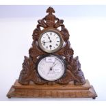 A late Victorian desktop clock and barometer set, in a carved oak case,