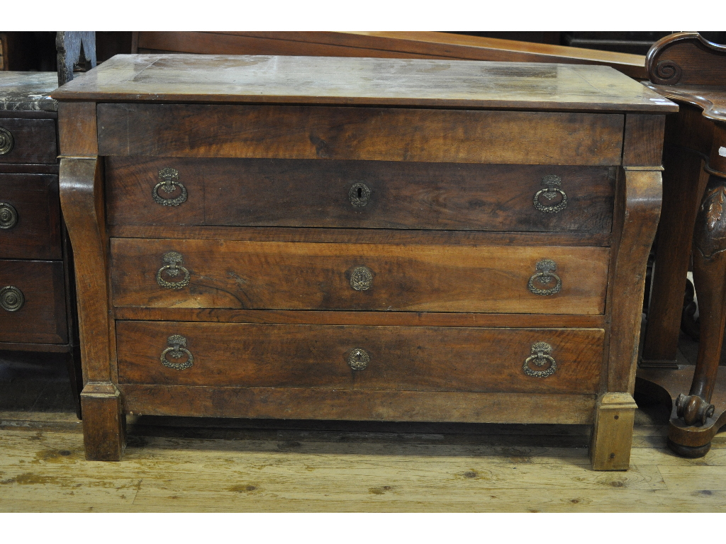 A late 19th century Continental walnut chest, having four long drawers,