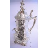 A large plated jug and cover, decorated figures,