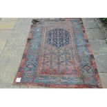 A Persian rug, with central medallion,