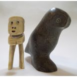 An Inuit carved figure, of an owl, 12 cm high, and a similar bone figure, 10.