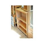 A modern oak open bookcase, 98 cm wide, and a similar display case,