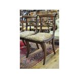 A set of four Regency mahogany dining chairs,