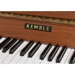 A Kemble upright piano, of small proportions, in a teak case, 143 cm wide x 102 cm high,