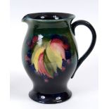 A Moorcroft pottery Leaf and Berry jug,