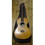 A Jose Fernandez acoustic guitar, with a rosewood back and mother of pearl inlay,
