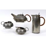A Liberty & Co English Pewter four piece tea service, designed by Archibald Knox,