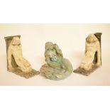 A pair of Emile Monier pottery bookends, in the form of Art Deco figures, and a pottery soap dish,