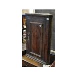 An oak hanging corner cupboard, a Victorian gilt gesso wall mirror, damages,
