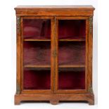 A Victorian inlaid walnut display cabinet, having a pair of glazed doors, and with brass mounts,