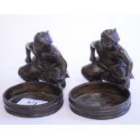 A pair of Japanese bronze figures, with barrels, repaired,