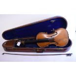 A violin, with a 14 inch two piece back,