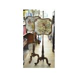 A pair of Victorian rosewood pole screens,