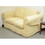 An upholstered two seater settee