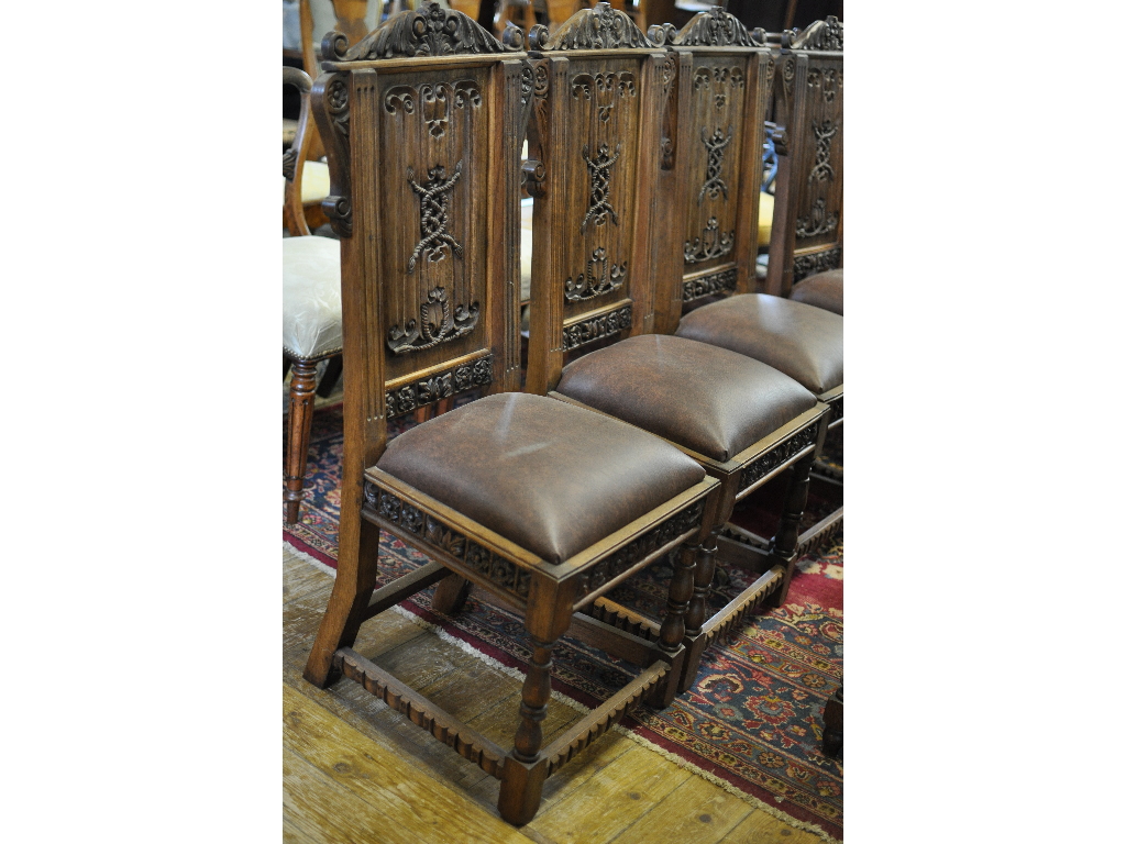 A set of four 17th century style dining chairs,