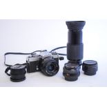 A Minolta camera, with lenses and other accessories,