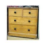 A late Victorian pine chest, of four drawers,