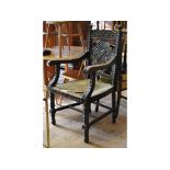 A late Victorian carved oak carver chair,