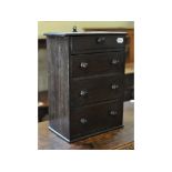 A tabletop chest, of four graduated long drawers,