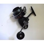 A Mitchell 486 open face spinning reel, a Daiwa fly reel,