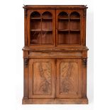 A Victorian mahogany cabinet, having a pair of glazed doors above a frieze with a drawer,