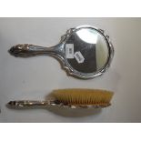 A silver hand mirror, initialled, and a matching hair brush,