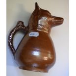 A 19th century salt glazed pottery fox jug, 22 cm high,
