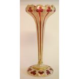 A late 19th century ruby glass lustre, overlaid with opaque glass, and decorated in gilt,