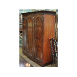 A Victorian mahogany breakfront three door wardrobe,