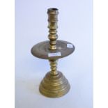 A Dutch style brass candlestick,