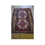 A Persian rug, with geometric motifs on a cream ground, within a multi border,