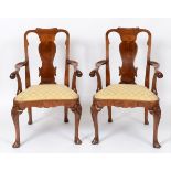 A set of six early 18th century style walnut dining chairs, with solid vase shaped splats,