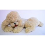 A plush pyjama case, in the form of a poodle,
