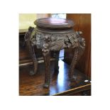 A Chinese carved hardwood jardiniere stand,