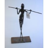 An African metal figure, with a spear, 28.