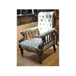 A late Victorian walnut armchair,