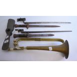 Four bayonets, a bugle, and a brass propeller,