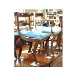 A set of five mahogany dining chairs, with brass and rosewood inlay,